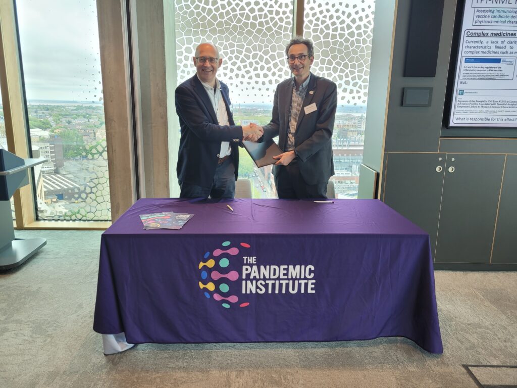 Director Tom Solomon shaking hands with Professor Julian Braybrook, UK Government Chemist