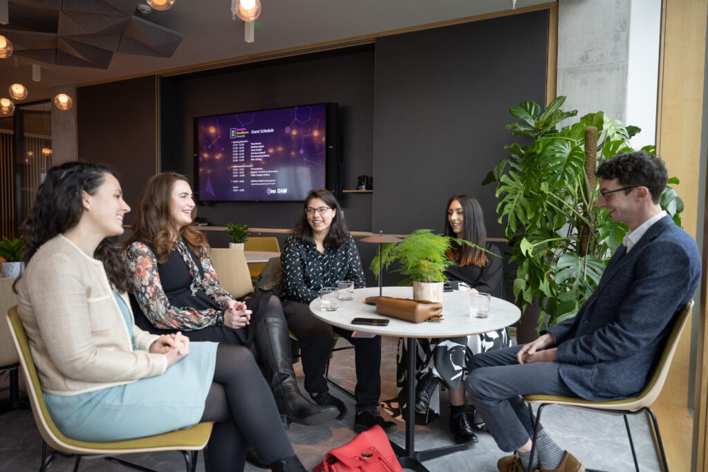 Group of people chatting in infromal setting